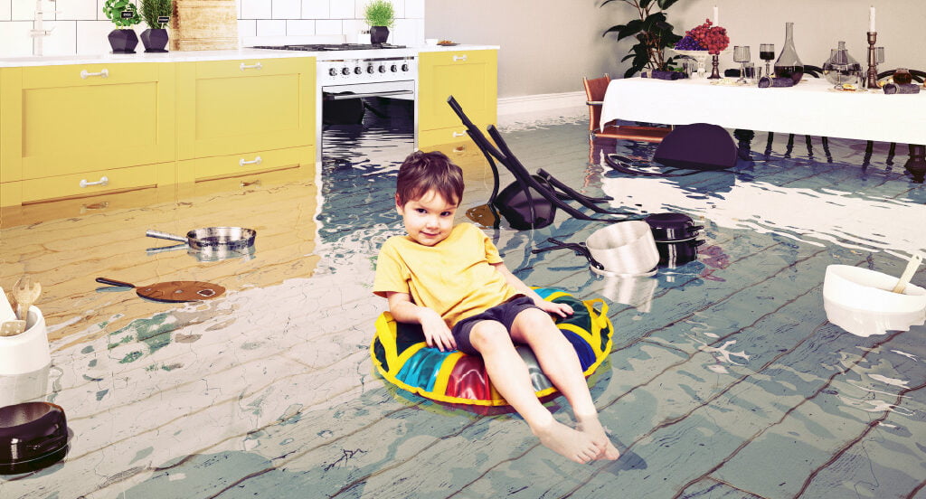 child floating in flooded kitchen