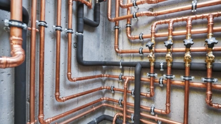 Plumber from ALL PIPES installing a hot water supply system