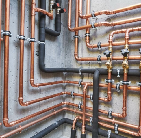 Plumber from ALL PIPES installing a hot water supply system